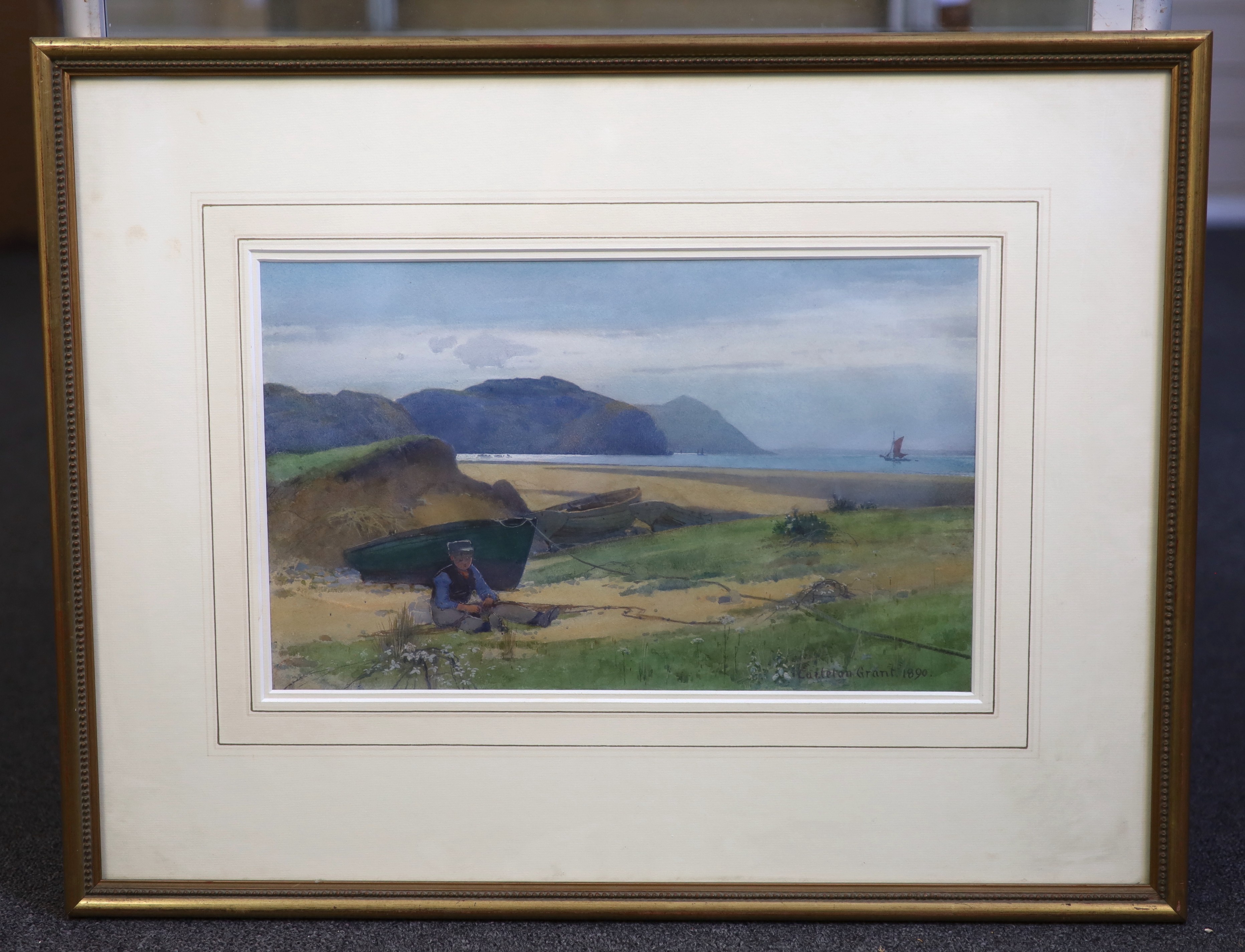 Carleton Grant (1860-1930), watercolour, Fisherboy mending nets on the seashore, signed and dated 1890, 24 x 39cm